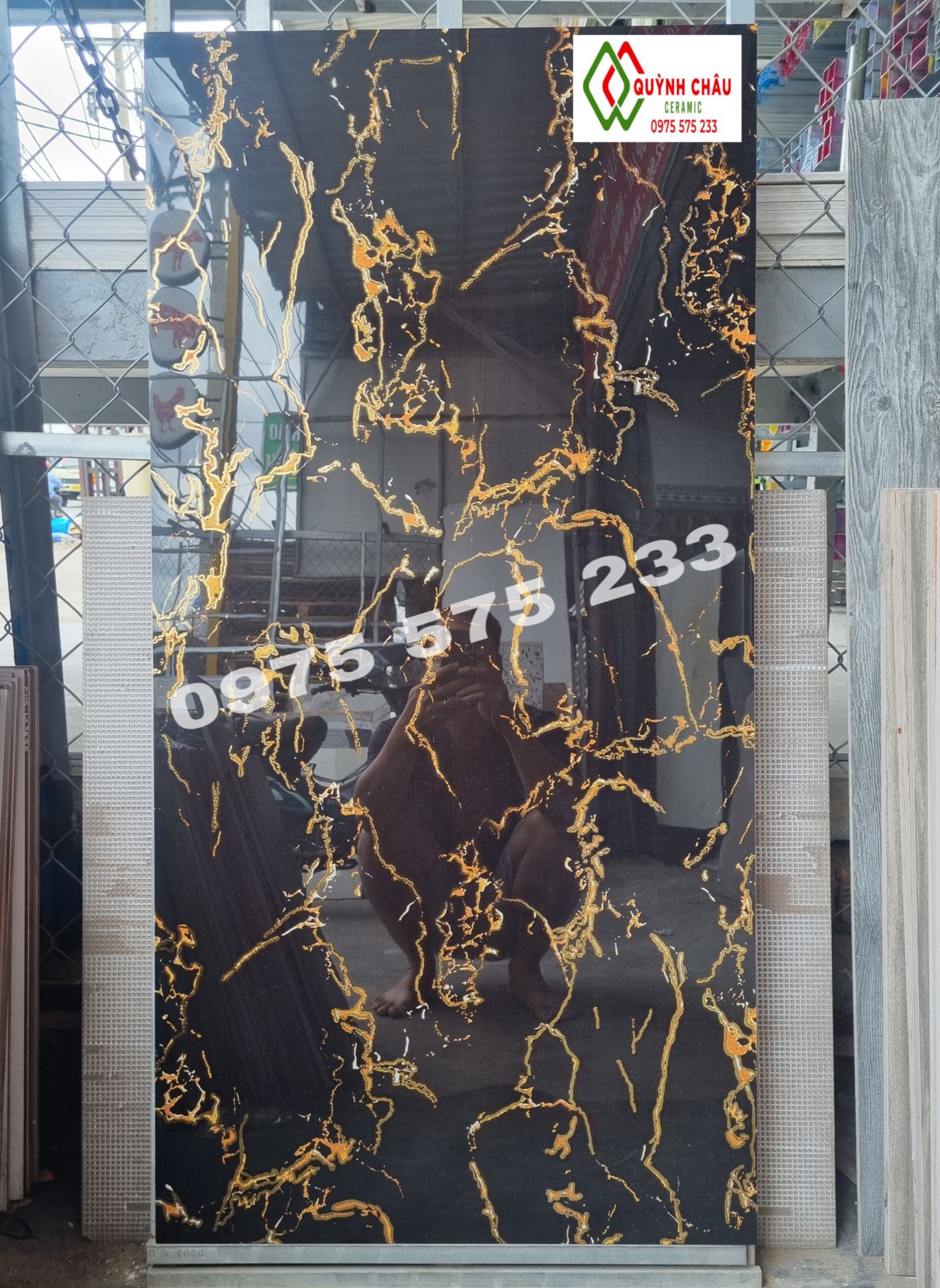 Gạch 600x1200 đen khắc kim vân vàng cam bóng kiếng